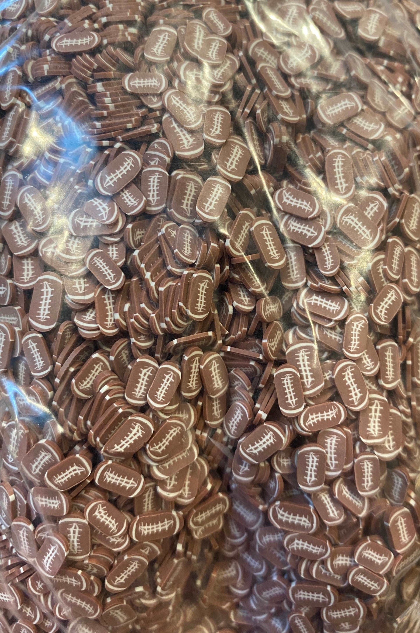Clay sprinkles footballs